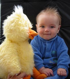 Thomas Edward Glass with stuffed yellow duck toy